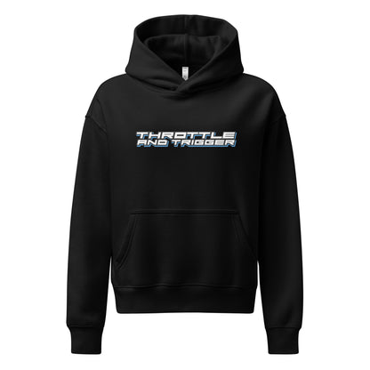 Black women’s relaxed hoodie with hood, front pocket, and “THROTTLE AND TRIGGER” print.