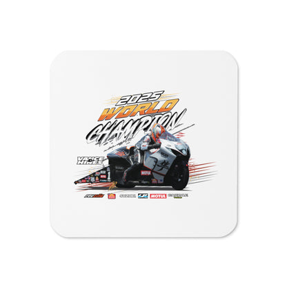 Square cork-back coaster with white top and racing motorcycle graphic