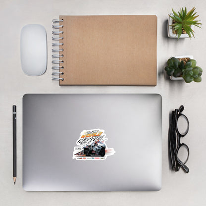 Die-cut racing championship sticker placed on a gray laptop screen