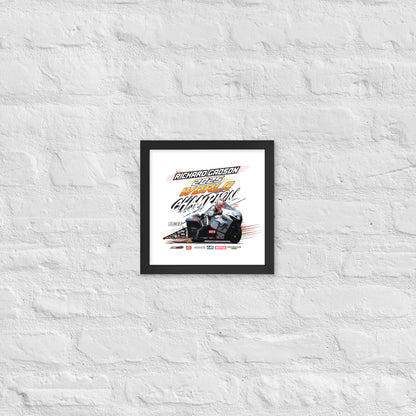 Small framed racing poster with black border and colorful racing vehicle artwork with title