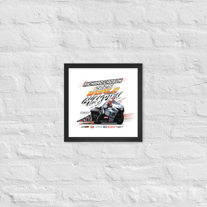 Small framed racing poster with black border showing race car graphic and “World Champion” style text